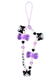 Kuromi Charm Bead Strap Deco Series. Phone charm , purple bows, and 'Kuromi' branding on a white background